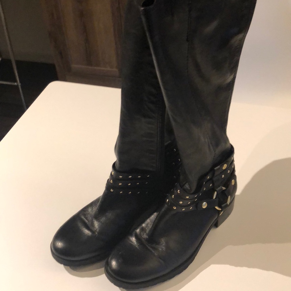High black boots with gold accents